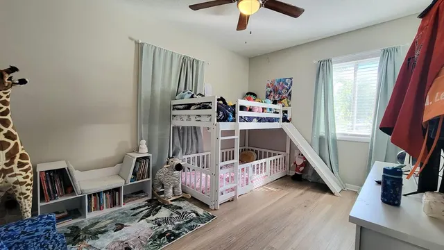 a view of a livingroom with furniture and hardwood floor