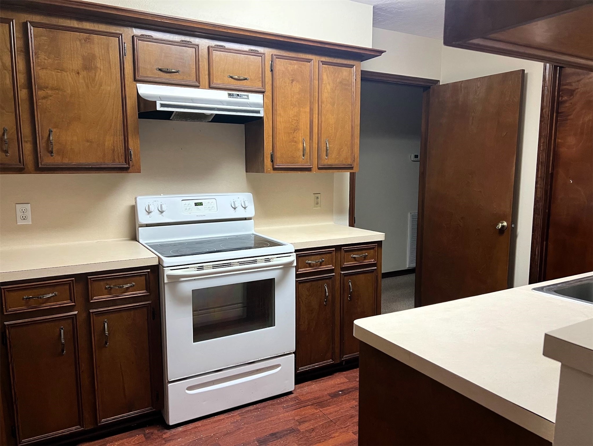 102 Briar Ridge Drive Bellville, TX 77418 - Photo 4 of 14 a kitchen with a stove and a microwave
