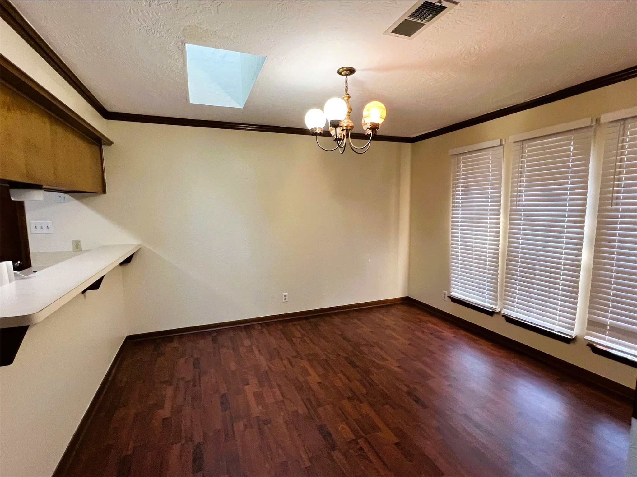 102 Briar Ridge Drive Bellville, TX 77418 - Photo 6 of 14 a view of a room with wooden floor chandelier and a window