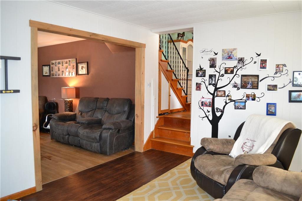 The mudroom leads to the spacious living room and dining room.