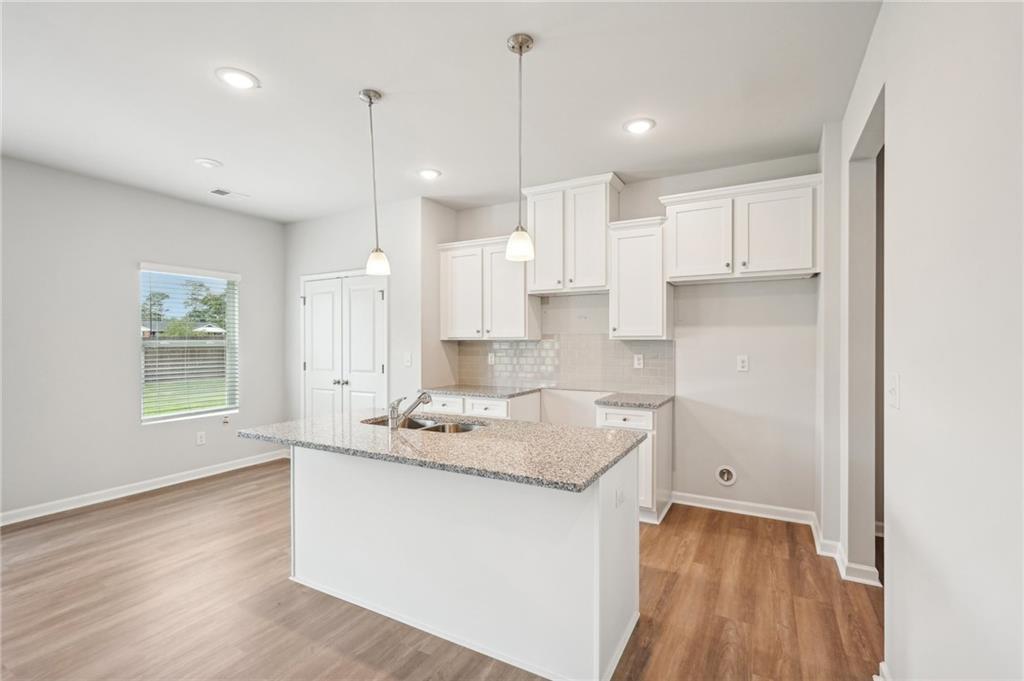 3014 Viewpark Circle Conyers, GA 30013 - Photo 11 of 44 a kitchen with a sink stove and cabinets