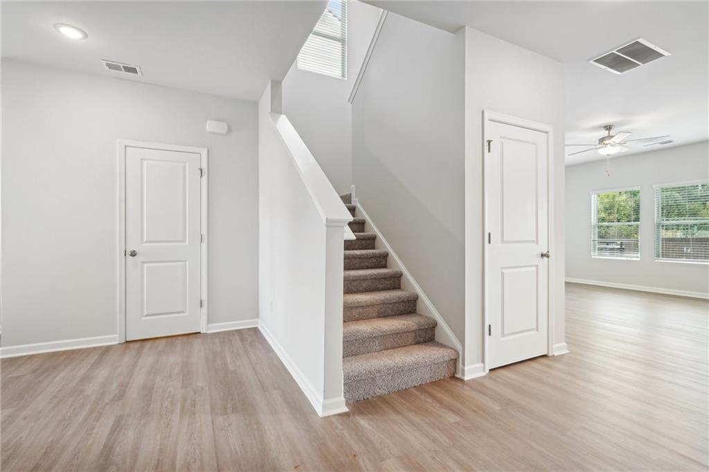 3014 Viewpark Circle Conyers, GA 30013 - Photo 17 of 44 wooden floor in an empty room with a window and wooden floor