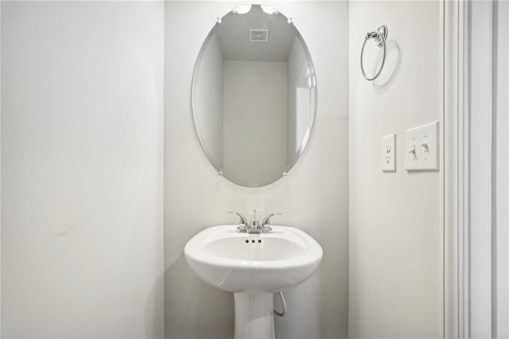 3014 Viewpark Circle Conyers, GA 30013 - Photo 18 of 44 a bathroom with a sink a mirror and a shower
