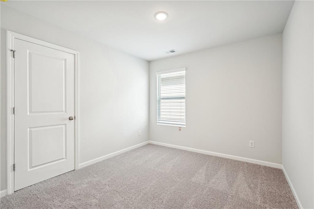 3014 Viewpark Circle Conyers, GA 30013 - Photo 38 of 44 a view of an empty room with a window