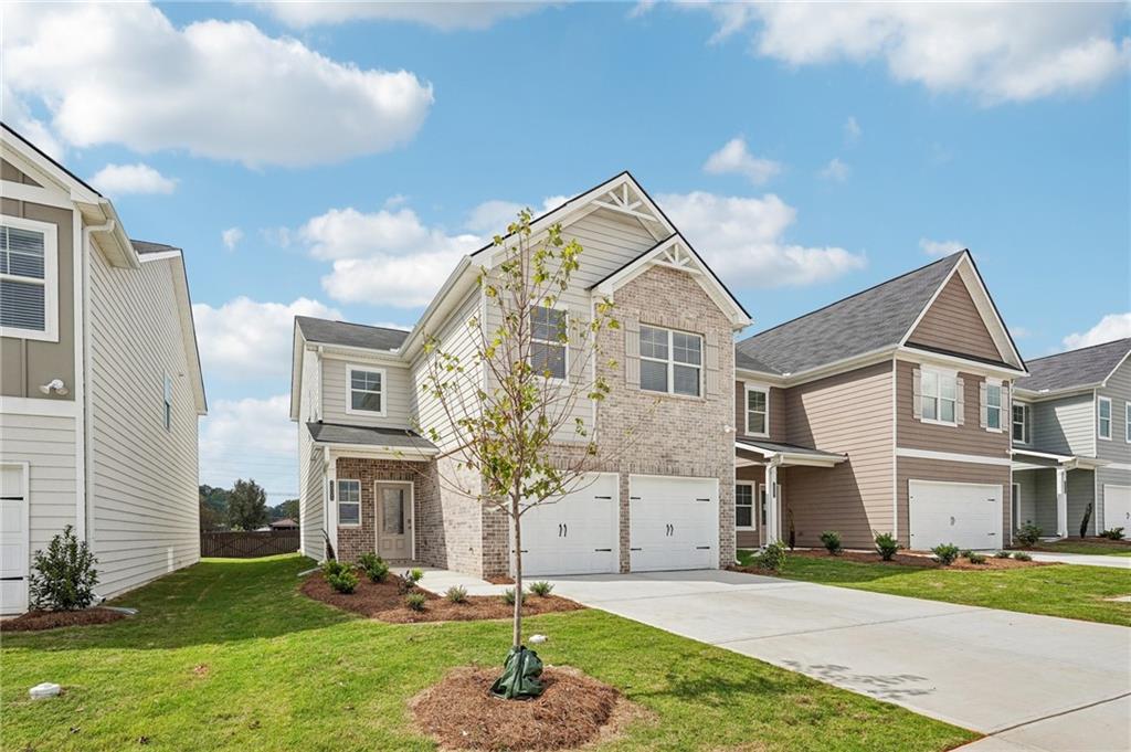 3014 Viewpark Circle Conyers, GA 30013 - Photo 4 of 44 a front view of a house with a yard