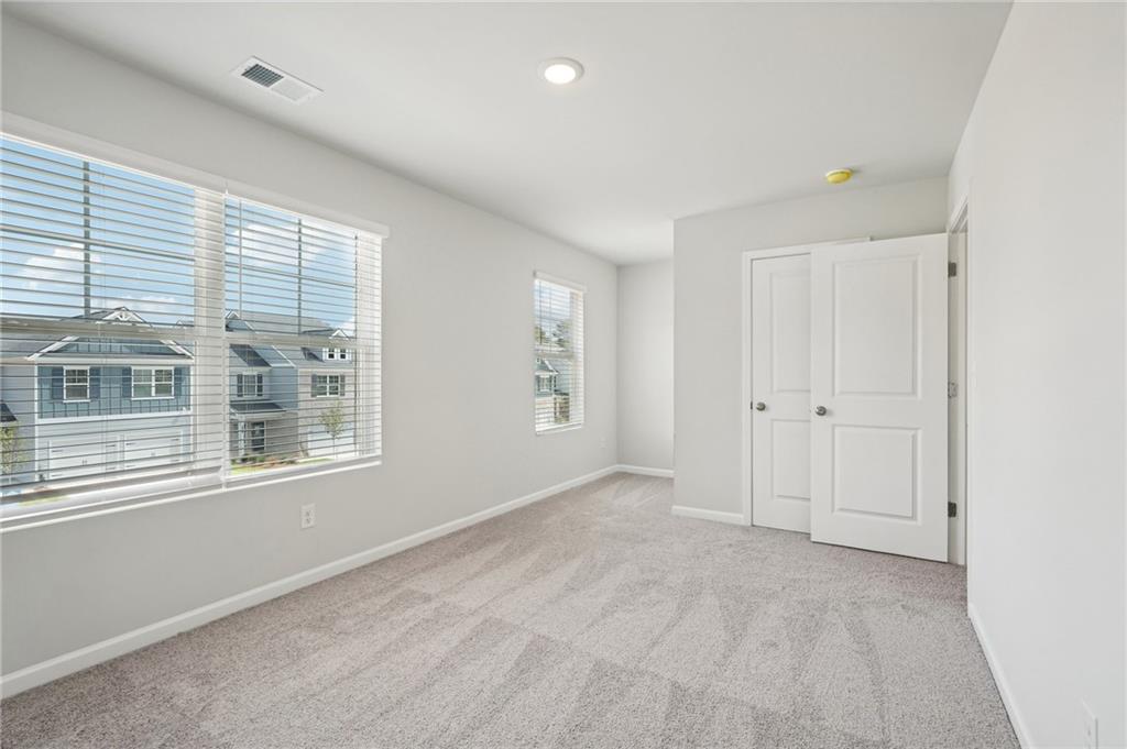 3014 Viewpark Circle Conyers, GA 30013 - Photo 42 of 44 a view of an empty room with a window