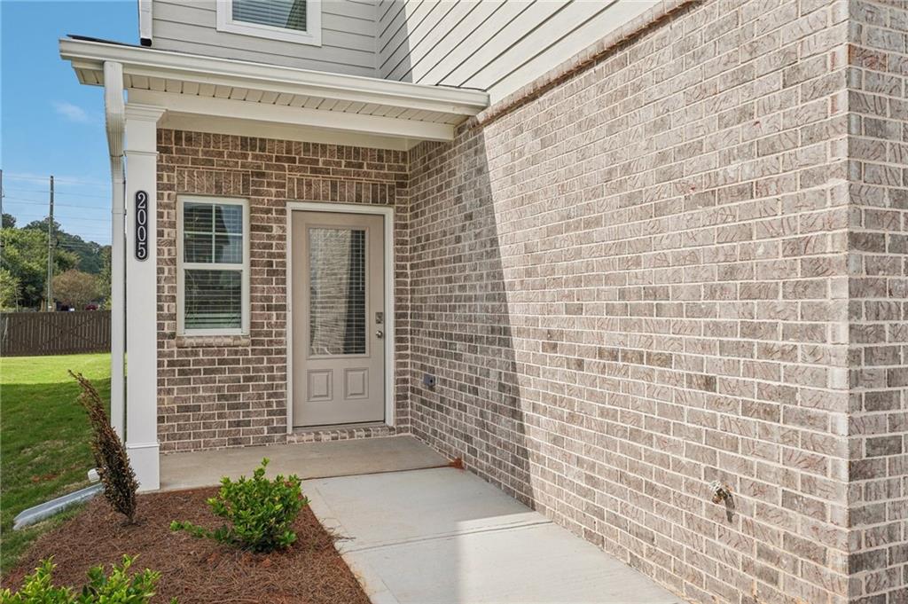 3014 Viewpark Circle Conyers, GA 30013 - Photo 6 of 44 a front view of a house with a garden