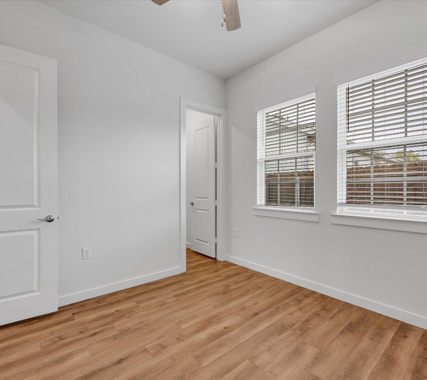 2703-609 Rockhill Road McKinney, TX 75072 - Photo 14 of 18 a view of empty room with wooden floor and fan