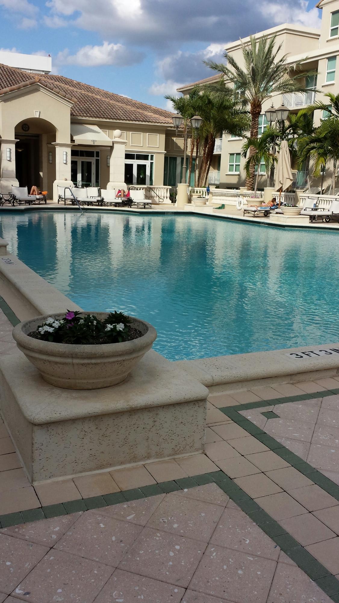 99 Southeast Mizner Boulevard, Unit 219 Boca Raton, FL 33432 - Photo 2 of 14 a view of a swimming pool with a lake view