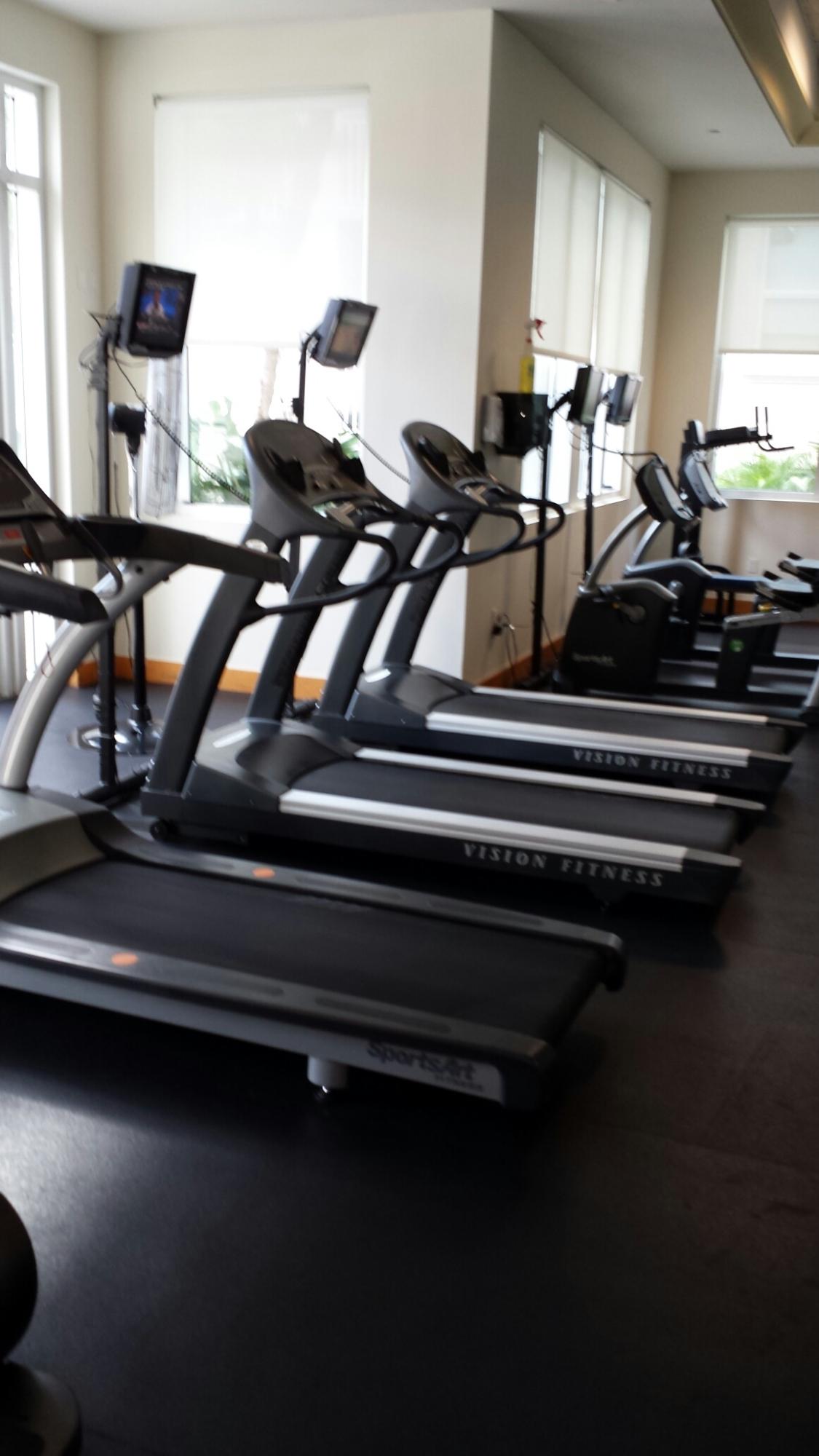 99 Southeast Mizner Boulevard, Unit 219 Boca Raton, FL 33432 - Photo 4 of 14 a view of gym equipment and wooden floor