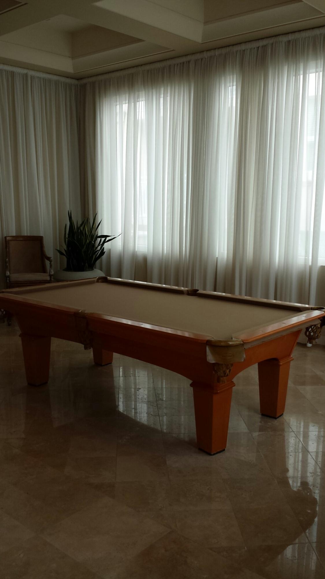 99 Southeast Mizner Boulevard, Unit 219 Boca Raton, FL 33432 - Photo 6 of 14 a room with a table and chair