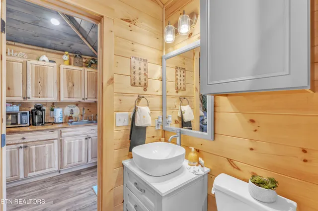 a view of a dry yard with lots of bushes