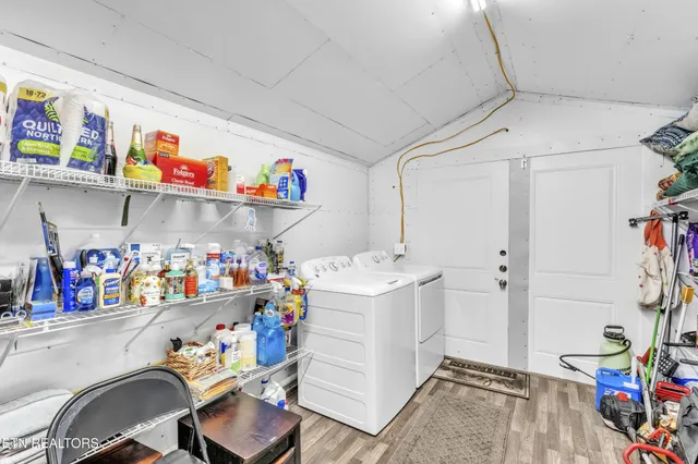 a view of a house with backyard porch and sitting area