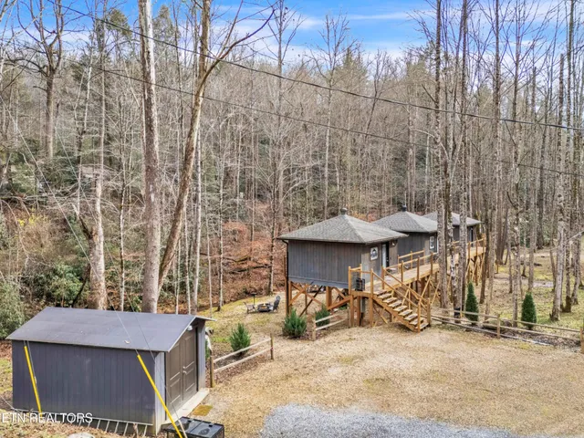 a view of a yard with table and chairs