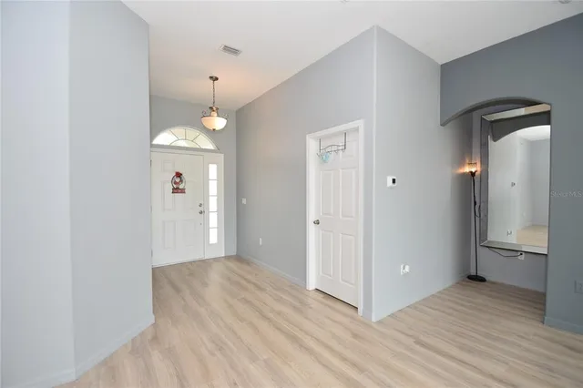 a view of a room with cabinet and wooden floor