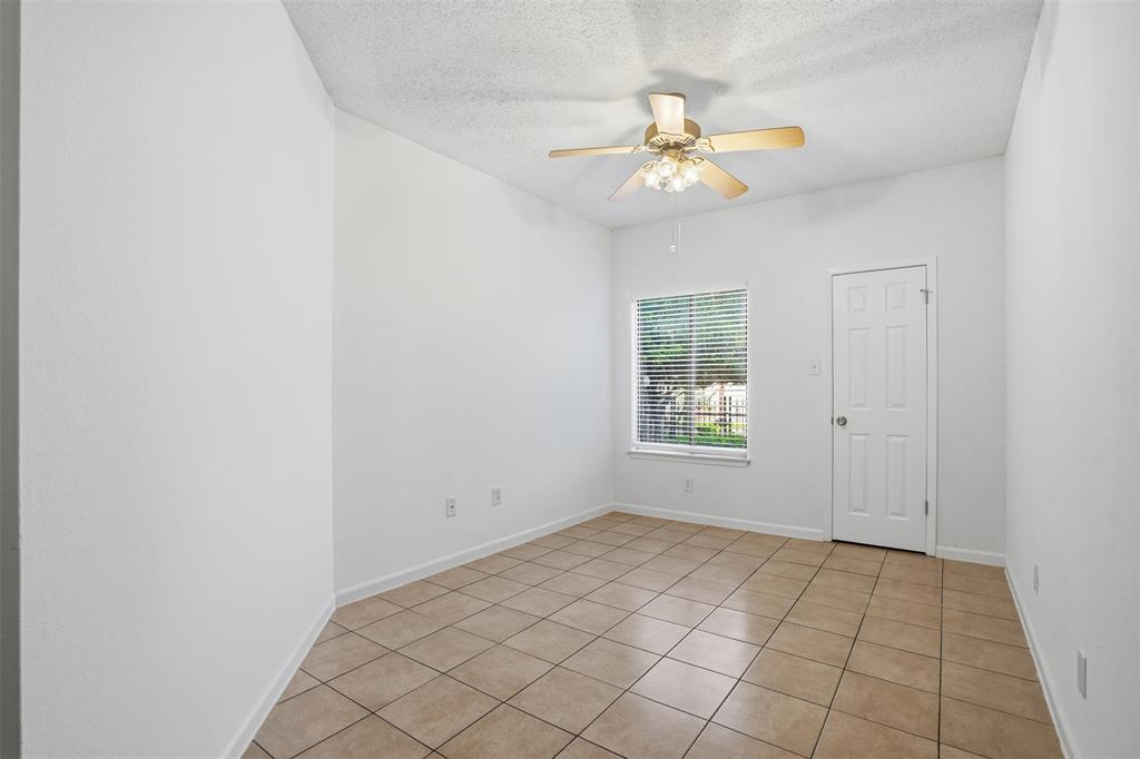 5550 Spring Valley Road, Unit F14 Dallas, TX 75254 - Photo 11 of 15 a view of an empty room with a window