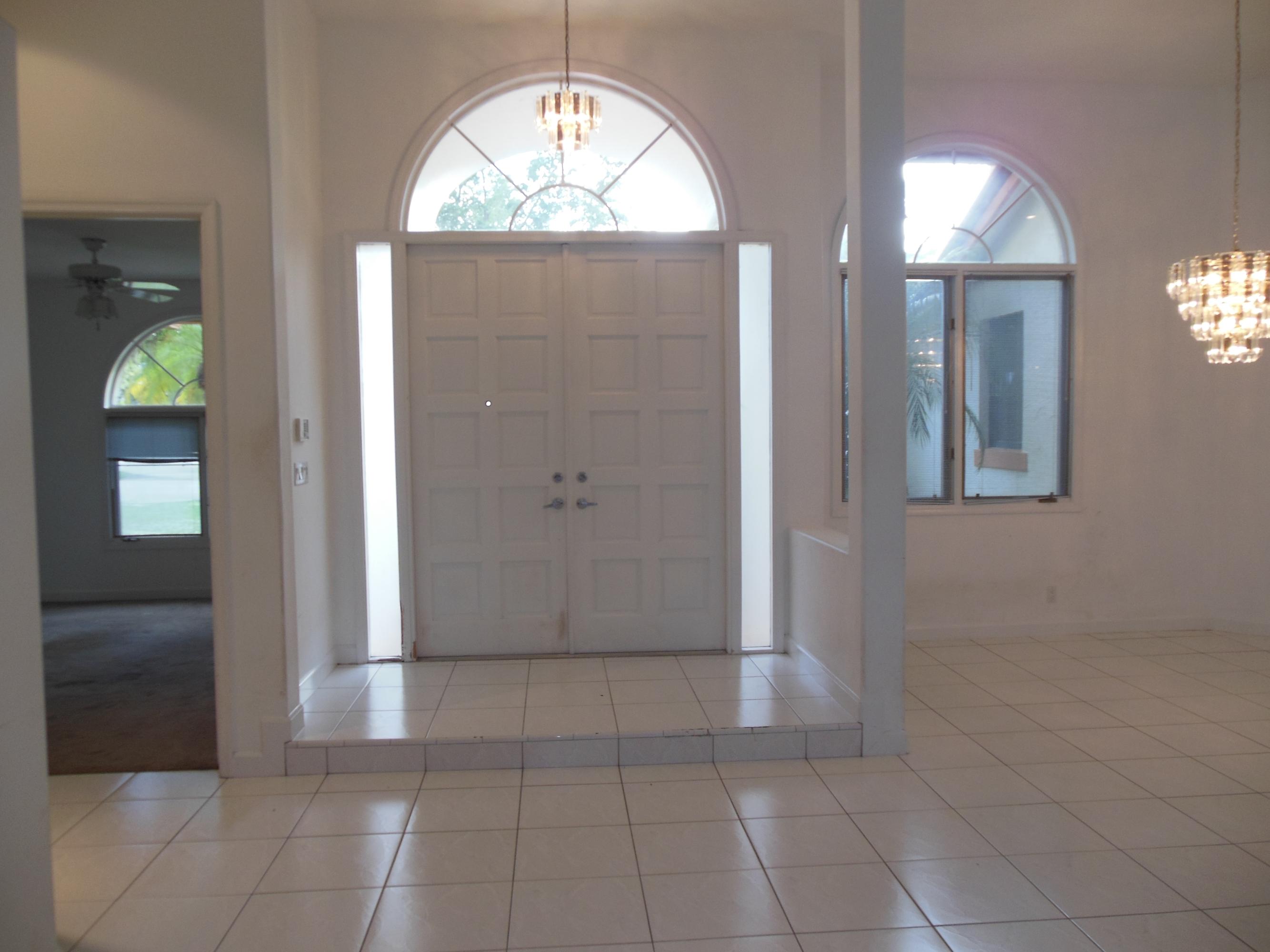 2771 Northwest 49th Street Boca Raton, FL 33434 - Photo 2 of 32 Foyer w/Arched window/side lights