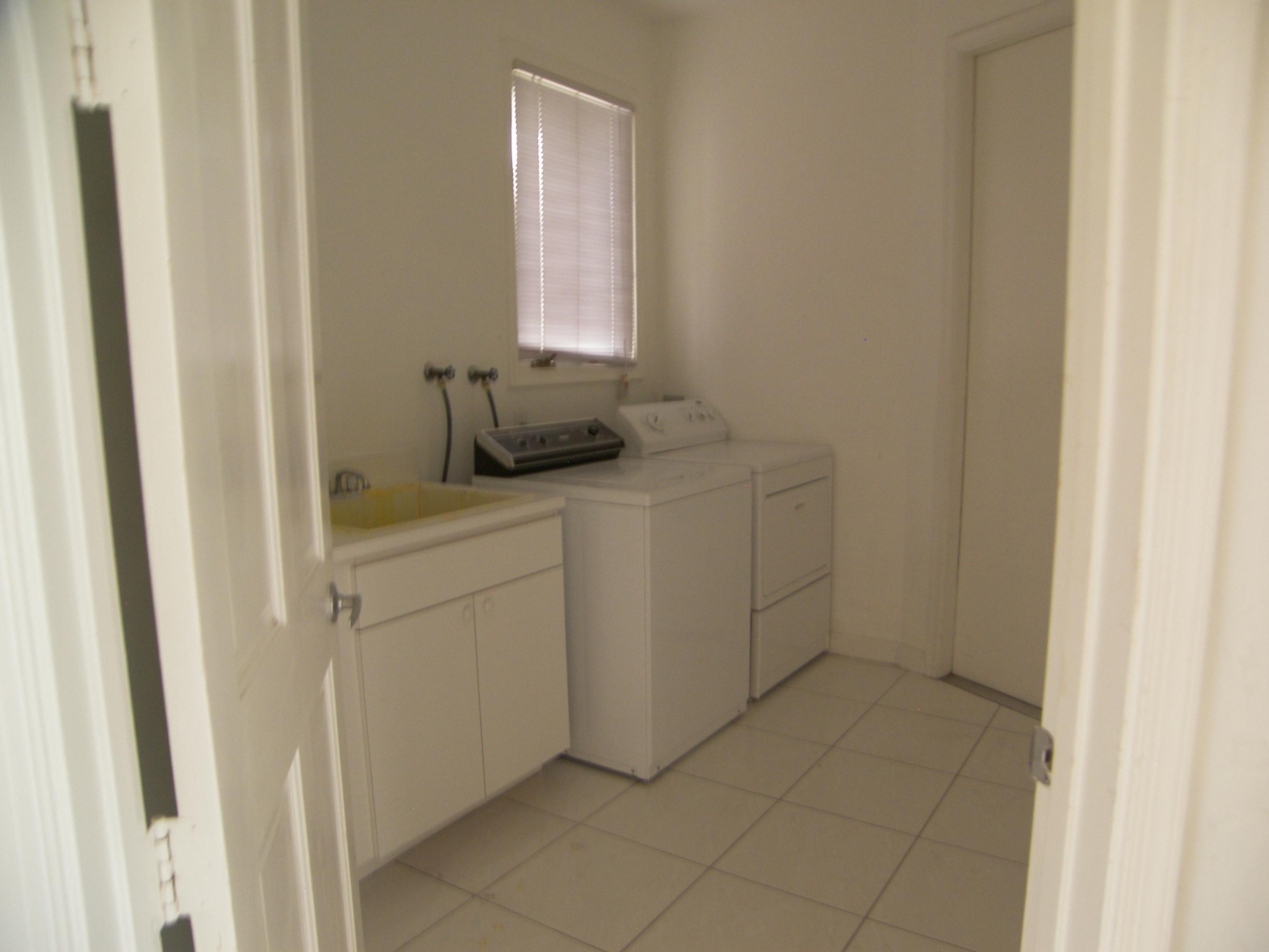 2771 Northwest 49th Street Boca Raton, FL 33434 - Photo 21 of 32 Laundry Room w/utility sink