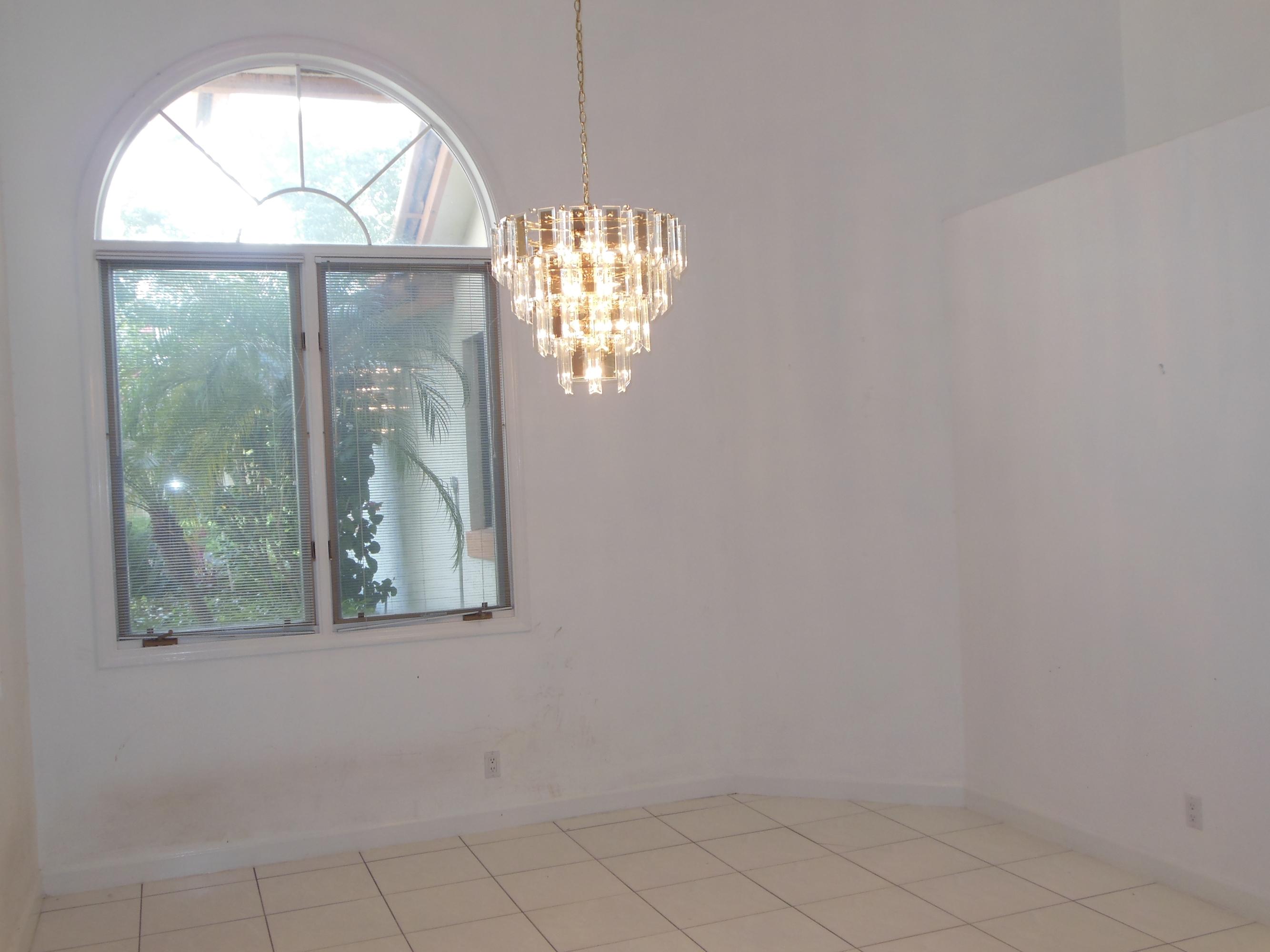 2771 Northwest 49th Street Boca Raton, FL 33434 - Photo 8 of 32 Formal Dining Room w/Arched Window