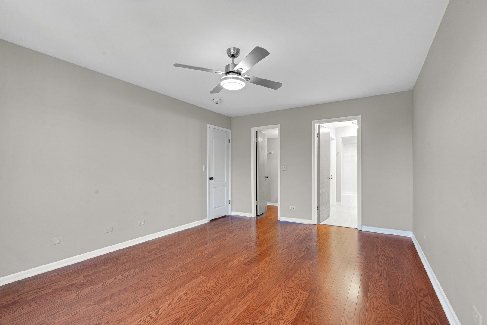 400 East Dundee Road, Unit 408 Buffalo Grove, IL 60089 - Photo 14 of 24 a view of an empty room with window and wooden floor