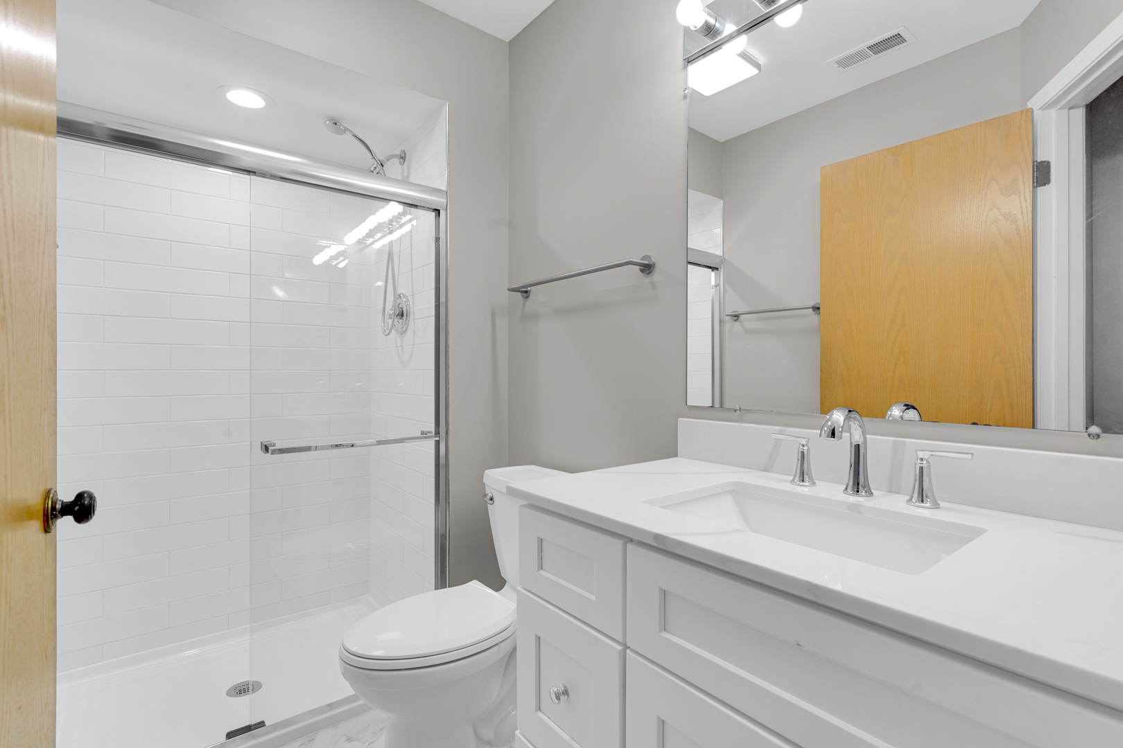 400 East Dundee Road, Unit 408 Buffalo Grove, IL 60089 - Photo 18 of 24 a bathroom with a sink toilet and shower