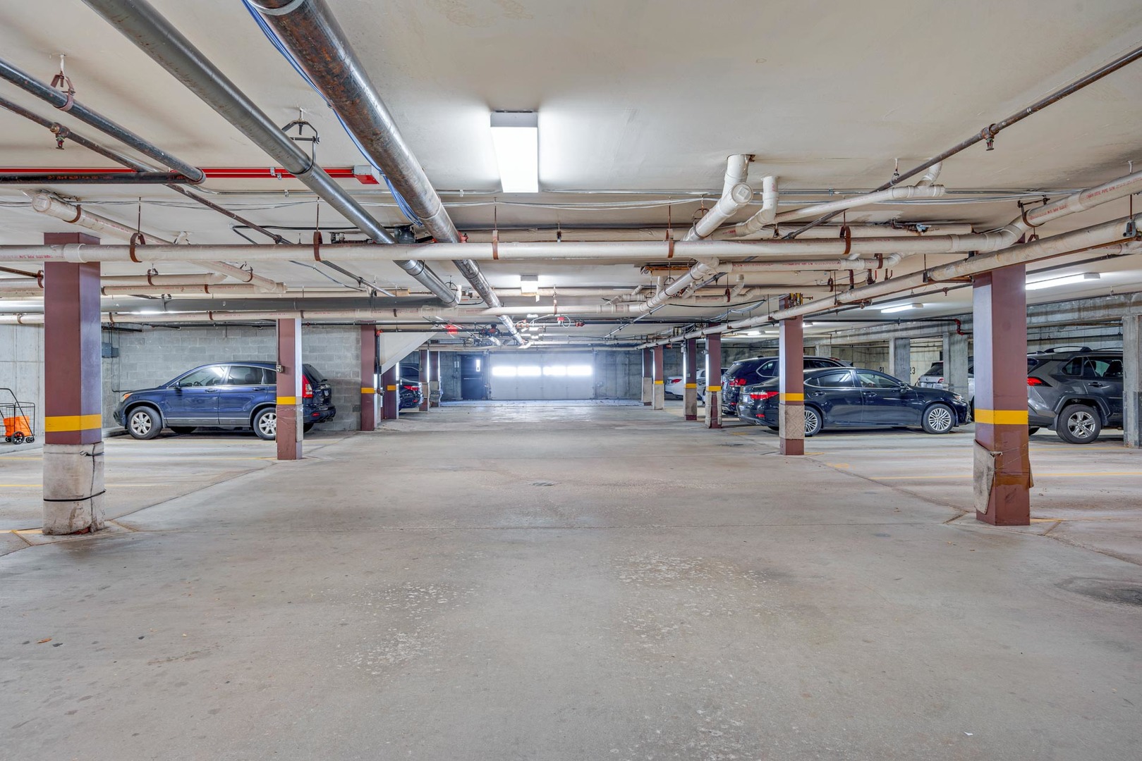 400 East Dundee Road, Unit 408 Buffalo Grove, IL 60089 - Photo 22 of 24 a view of parking garage with cars
