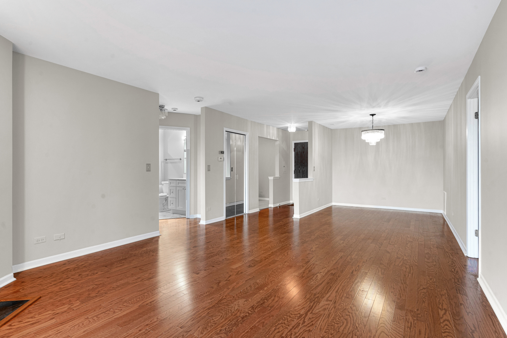 400 East Dundee Road, Unit 408 Buffalo Grove, IL 60089 - Photo 7 of 24 a view of an empty room with wooden floor