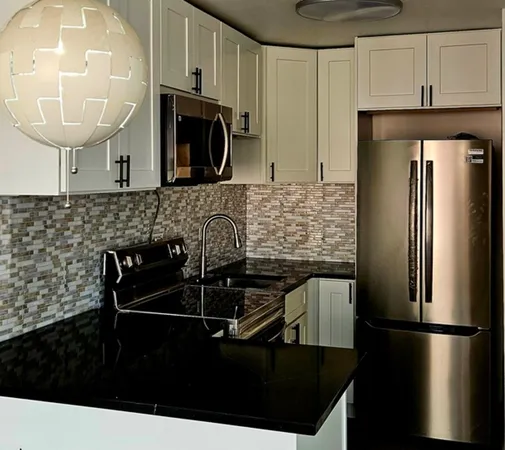 a kitchen with a sink and refrigerator
