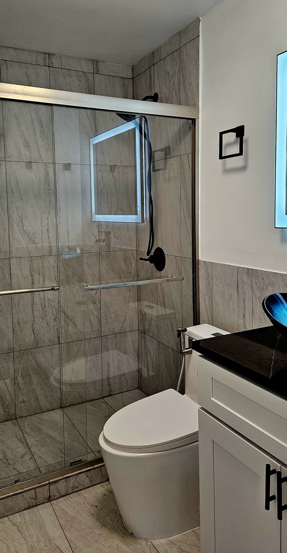 5455 North Sheridan Road, Unit 1807 Chicago, IL 60640 - Photo 6 of 10 a bathroom with a sink a toilet and shower