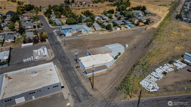 an aerial view of a house with a yard and a garage