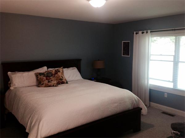 82 Shaw Road Goshen, MA 01330 - Photo 20 of 29 a large bed sitting in a bedroom next to a window