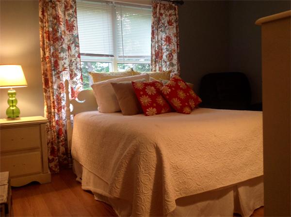82 Shaw Road Goshen, MA 01330 - Photo 25 of 29 a bed sitting in a bedroom next to a lamp