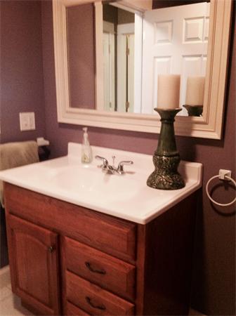 82 Shaw Road Goshen, MA 01330 - Photo 28 of 29 a bathroom with a sink and a mirror