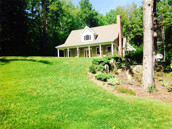 82 Shaw Road Goshen, MA 01330 - Photo 3 of 29 a front view of house with yard and green space