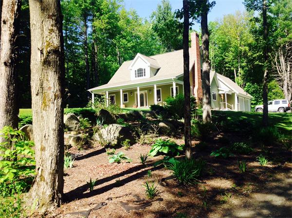 82 Shaw Road Goshen, MA 01330 - Photo 4 of 29 a view of a house with wooden fence next to a yard