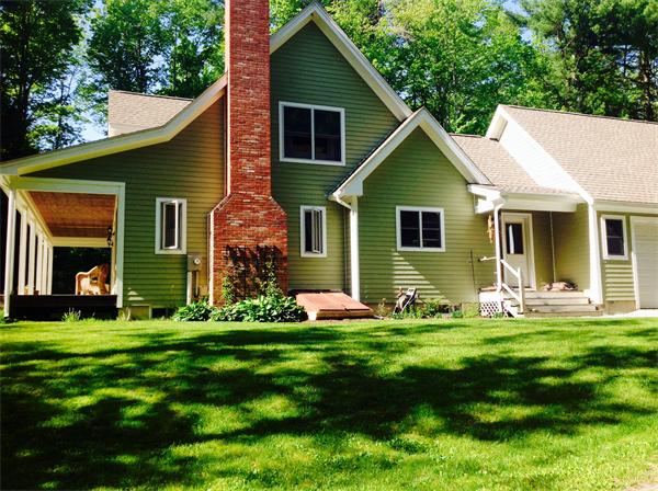 82 Shaw Road Goshen, MA 01330 - Photo 5 of 29 a front view of a house with a yard