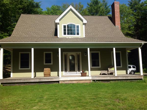 82 Shaw Road Goshen, MA 01330 - Photo 7 of 29 a front view of a house with a yard patio and swimming pool