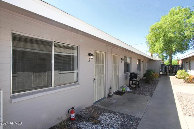 a backyard of a house with seating space