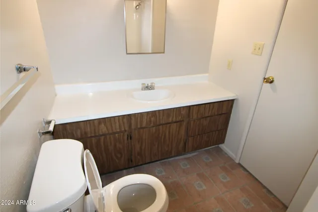 a white toilet sitting next to a shower curtain