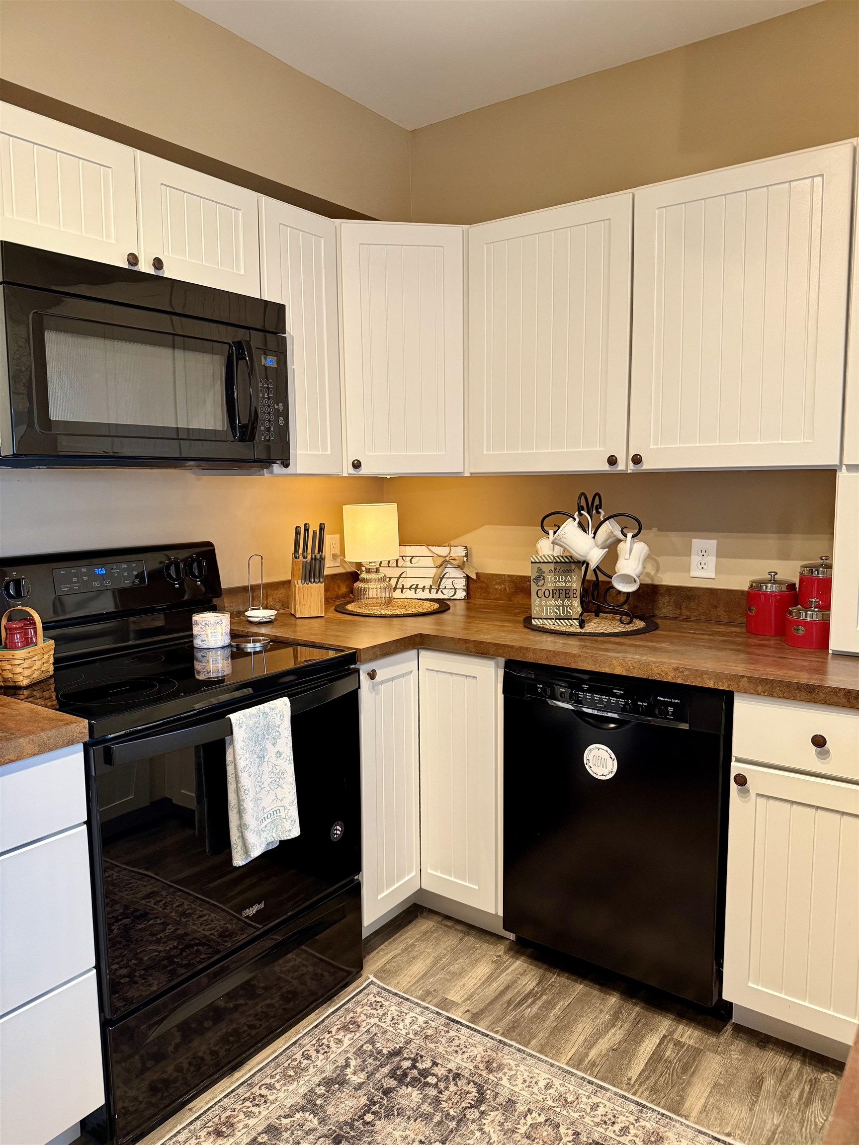 15385 Evergreen Valley Road Timberville, VA 22853 - Photo 4 of 44 a kitchen with stainless steel appliances granite countertop a stove a sink and a microwave