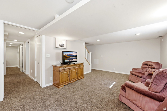310 East 600 South Centerville, UT 84014 - Photo 19 of 41 Carpeted entertainment area featuring recessed lighting, light gray wall paint, and white trim