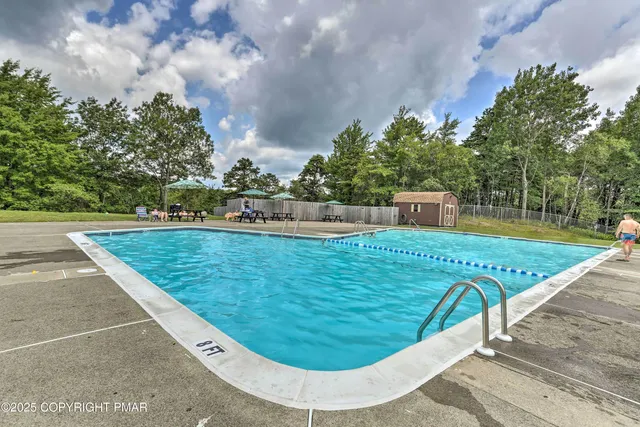 a view of a swimming pool with a patio