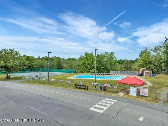 a view of a swimming pool with a patio