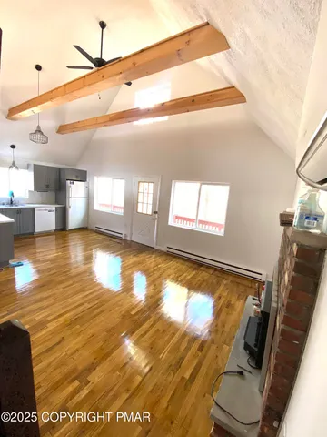 a view of a living room with a flat screen tv
