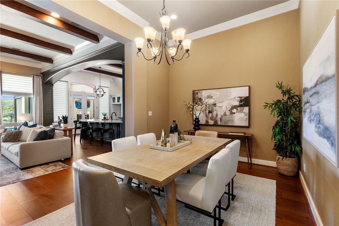 2833 Persimmon Ridge Court Bryan, TX 77807 - Photo 21 of 50 a view of a dining room with furniture and chandelier