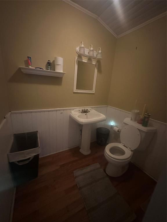 504 1st Street Terrell, TX 75160 - Photo 20 of 27 Pedestal sink with a wall-mounted mirror and a three-bulb vanity light fixture