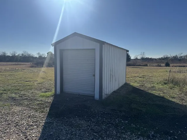 a terrace of a house with outdoor seating and lake view