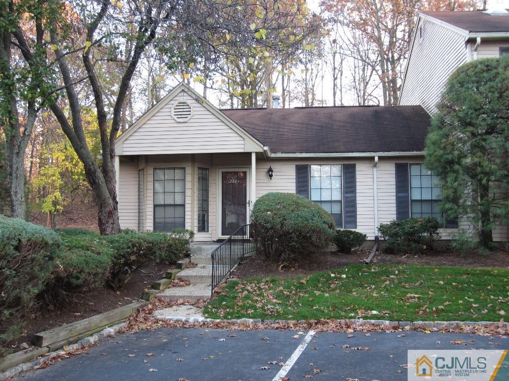 2201 Timber Oaks Road Edison, NJ 08820 - Photo 2 of 12 a front view of a house with garden