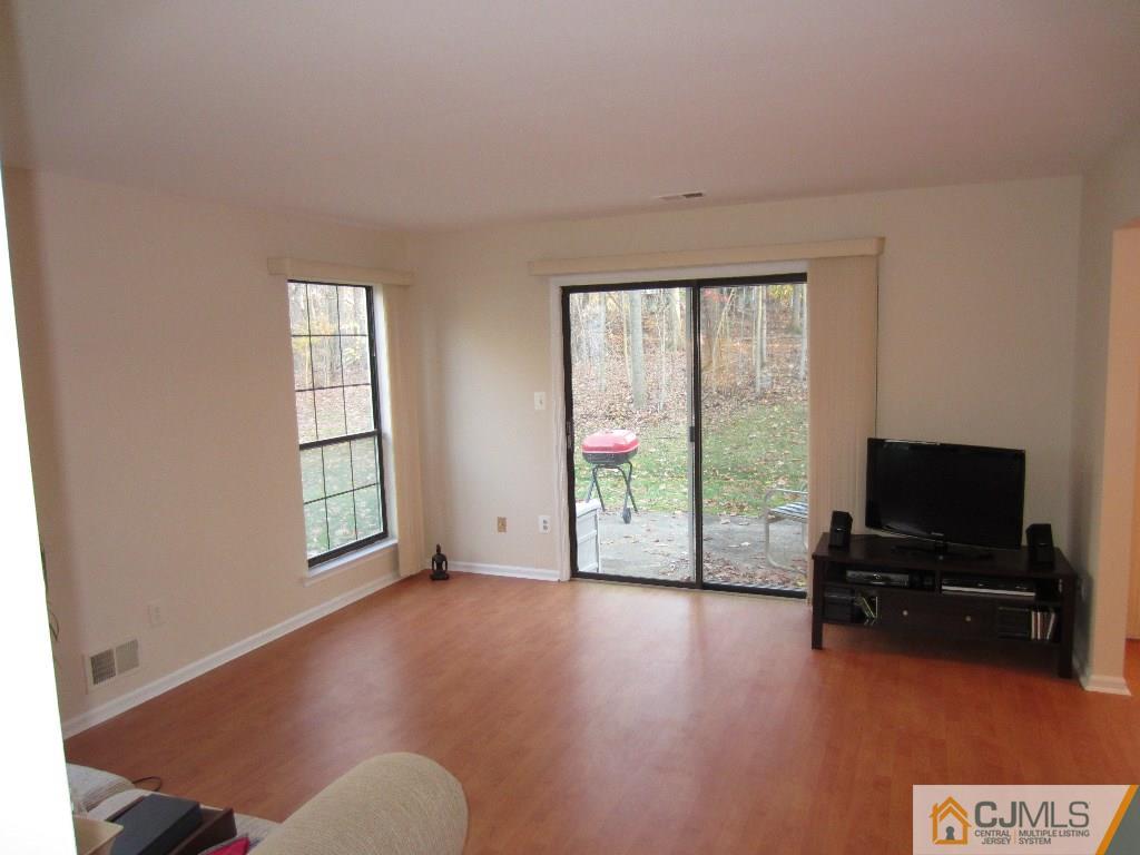 2201 Timber Oaks Road Edison, NJ 08820 - Photo 5 of 12 a view of livingroom with furniture flat screen tv and windows