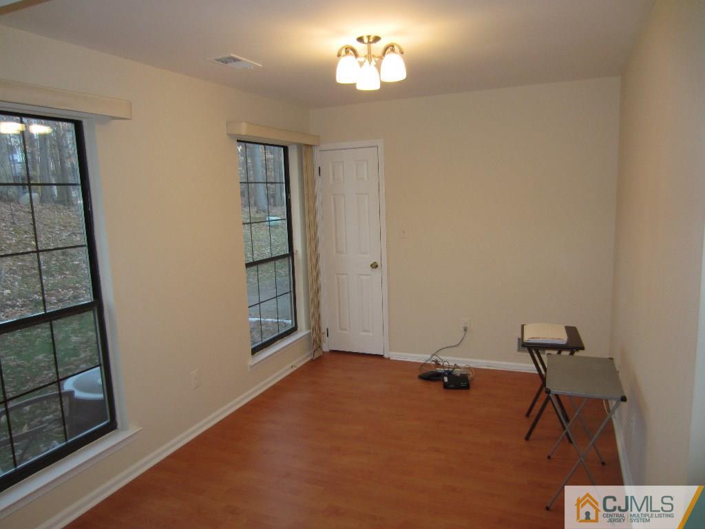 2201 Timber Oaks Road Edison, NJ 08820 - Photo 6 of 12 an empty room with windows